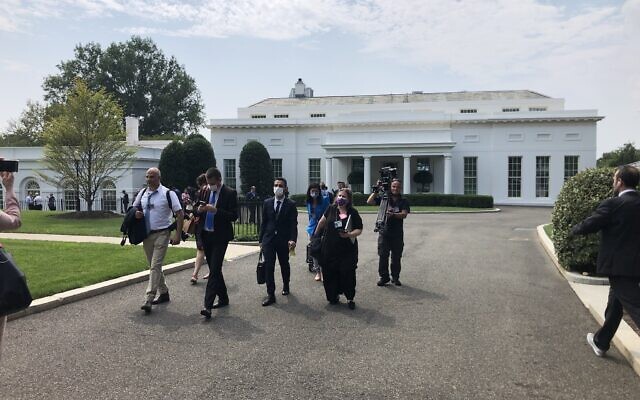Israeli reporters leave the White House as the meeting between US President Joe Biden and Prime Minister Naftali Bennett is delayed, August 26, 2021 (Lazar Berman/Times of Israel)