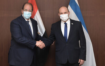 Prime Minister Naftali Bennett (right) meets with Abbas Kamel, the director of the Egyptian General Intelligence Directorate, in Jerusalem on August 18, 2021. (Kobi Gideon / GPO)