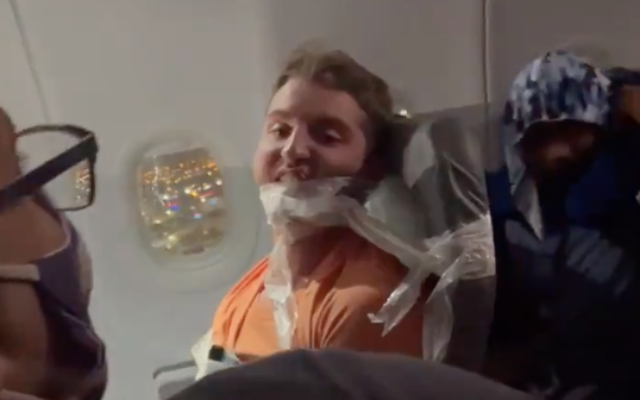 Maxwell Berry after being duct-taped to his chair on a Frontier Airlines flight to Miami in July 2021. (Screen capture/Twitter)