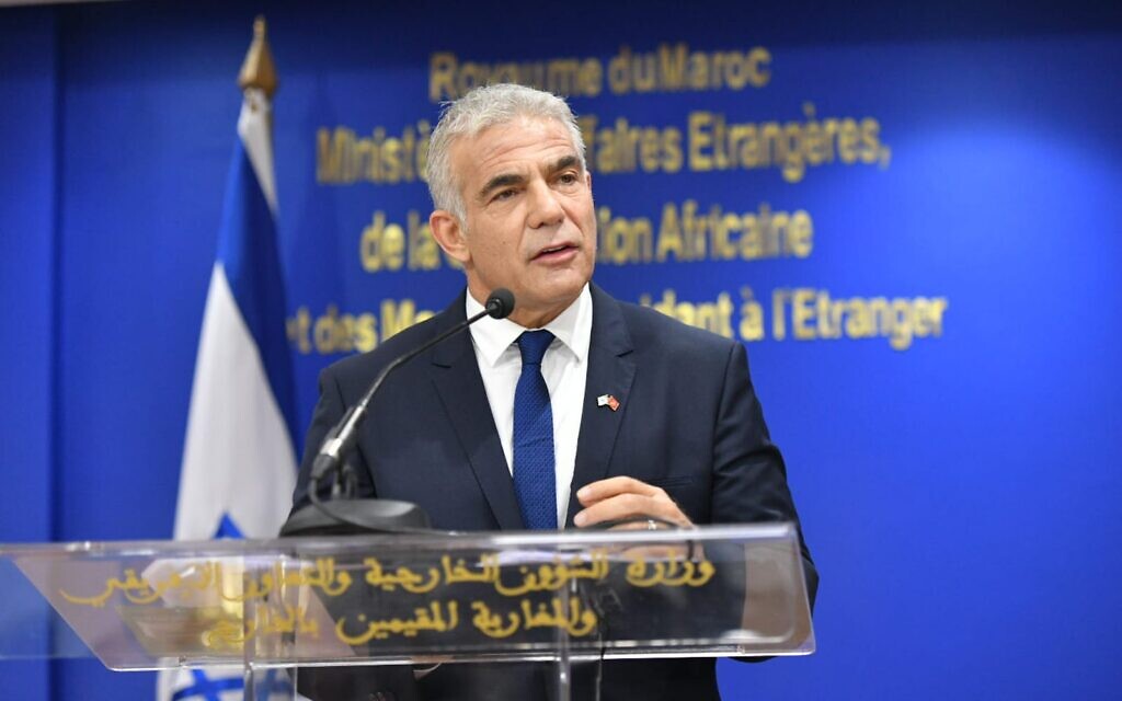 Foreign Minister Yair Lapid speaks at a ceremony with Moroccan Foreign Minister Nasser Bourita in Rabat, on August 11, 2021. (Shlomi Amsalem/GPO)