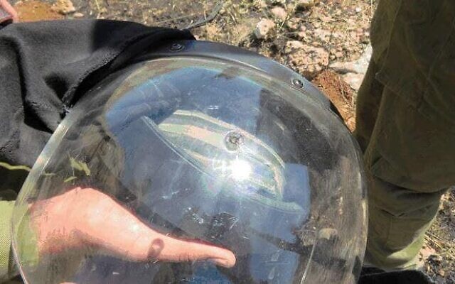 A bullet hole is seen on the helmet of an IDF soldier, who was shot at while responding to a violent protest near Hebron in the West Bank May 12, 2021. (Shin Bet)