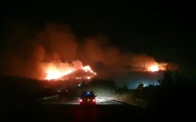 Fires are seen on the Ramim Ridge near Kiryat Shmona, on the Israel-Lebanon border, late on August 4, 2021. (screen capture: Twitter)