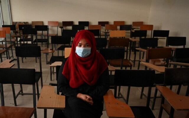 A student sits inside a classroom after private universities reopened in Kabul on September 6, 2021 (Aamir QURESHI / AFP)