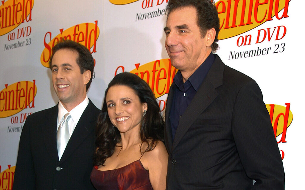 Jerry Seinfeld, left, Julia Louis Dreyfus and Michael Richards arrive to celebrate the release of the first three seasons of Seinfeld on DVD in New York, November 17, 2004. (AP/Louis Lanzano, File)