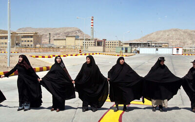 Iranian women form a human chain at the Isfahan Uranium Conversion Facility in support of Iran's nuclear program, outside the city of Isfahan, south of the capital Tehran, Aug. 16, 2005, (AP/Vahid Salemi)