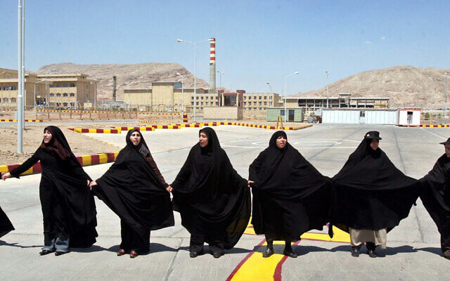 In this Aug. 16, 2005 file photo, Iranian women form a human chain, at the Isfahan Uranium Conversion Facility, in support of Iran's nuclear program, just outside the city of Isfahan, Iran, 410 kilometers (255 miles) south of the capital Tehran (AP Photo/Vahid Salemi, File)