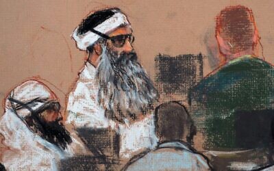 This Monday, Dec. 8, 2008 courtroom drawing by artist Janet Hamlin shows Khalid Sheikh Mohammed (center) and co-defendant Walid Bin Attash (left) attending a pre-trial session at Guantanamo Bay Naval Base, Cuba. (AP Photo/Janet Hamlin, Pool, File)