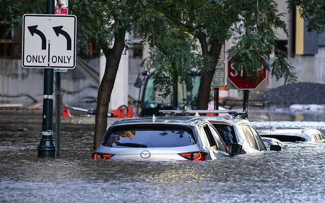 Vehicles are under water during flooding in Philadelphia, on Thursday, September 2, 2021, in the aftermath of downpours and high winds from the remnants of Hurricane Ida that hit the area. (AP Photo/Matt Rourke)