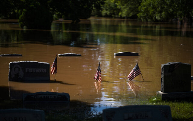 Headstones at a cemetery that flooded in Somerville, N.J. September 2, 2021. (AP Photo/Eduardo Munoz Alvarez)