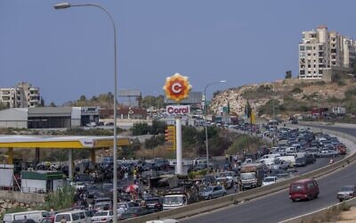 A general view of a petrol station on the main highway that links the Capital Beirut to south Lebanon as cars come from every direction to try and fill their tanks with gasoline, in the coastal town of Jiyeh, south of Beirut, Lebanon, Friday, Sept. 3, 2021 (AP Photo/ Hassan Ammar)