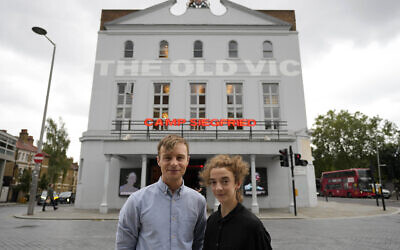 Actors Patsy Ferran, right and Luke Thallon, stars of the play Camp Siegfried, pose for a photographer in front of the Old Vic theatre in London, Friday, Sept. 10, 2021. (AP Photo/Frank Augstein)