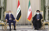 Iranian President Ebrahim Raisi, right, and Iraqi Prime Minister Mustafa al-Kadhimi during their meeting in Tehran, Iran, September 12, 2021. (Iranian Presidency Office via AP)
