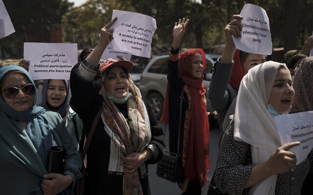 Women march to demand their rights under the Taliban rule during a demonstration near the former Women's Affairs Ministry building in Kabul, Afghanistan, September 19, 2021. (AP Photo)