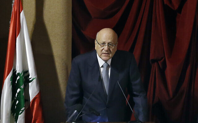Lebanese Prime Minister Najib Mikati speaks during a parliament session to confirm Lebanon's new government at a Beirut theater known as the UNESCO palace, so that parliament members could observe social distancing measures imposed over the coronavirus pandemic, on September 20, 2021. (AP/Bilal Hussein)