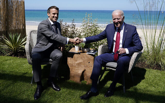 US President Joe Biden and French President Emmanuel Macron shake hands during a bilateral meeting at the G-7 summit, in Carbis Bay, England, June 12, 2021. (Patrick Semansky/AP)