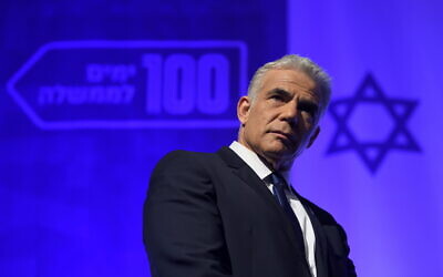 Israeli Foreign Minister and Yesh Atid party chairman Yair Lapid speaks at a Yesh Atid party conference marking 100 days since the formation of the Israeli government, in Shefayim, central Israel, September 22, 2021. (Gili Yaari/Flash90)