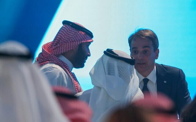 Saudi Crown Prince Mohammed bin Salman (left) and Greek Prime Minister Kyriakos Mitsotakis (right) participate in a session at the annual Future Investment Initiative conference in the Saudi capital Riyadh, on October 26, 2021. (Fayez Nureldine/AFP)