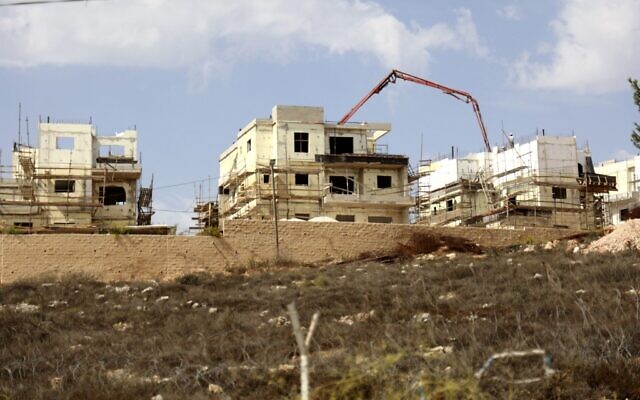 This file photo from October 13, 2021, shows construction in the Israeli settlement of Rahalim, located near the Palestinian village of Yatma, south of Nablus in the northern West Bank. (Jaafar Ashtiyeh/AFP)