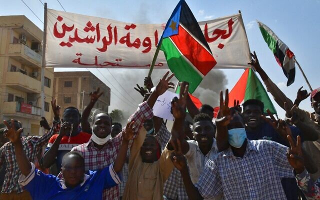 Sudanese anti-coup protesters attend a gathering in the capital Khartoum's twin city of Omdurman on October 30, 2021, to express their support for the country's democratic transition which a military takeover and deadly crackdown derailed. (AFP)