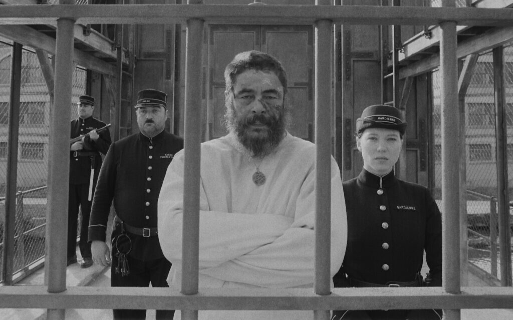 Benicio del Toro, center, as painter Moses Rosenthaler, and Léa Seydoux, right, as the prison guard Simone in "The French Dispatch." (Searchlight Pictures via JTA)