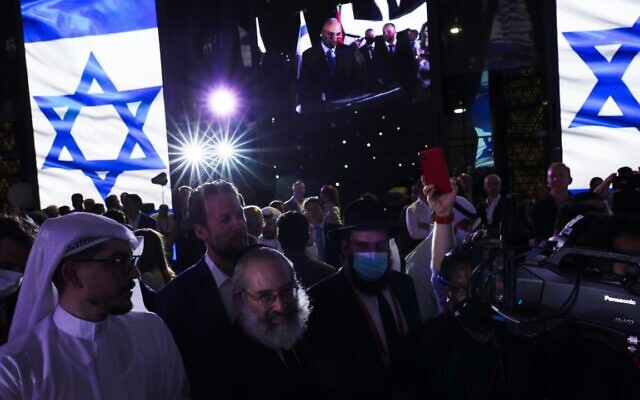 Jewish and Arab attendees celebrate the opening of the Israeli pavilion at Expo 2020 in Dubai, United Arab Emirates, on Thursday, October 7, 2021. (AP Photo/Jon Gambrell)