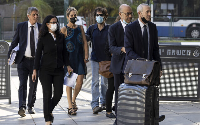 Aya Biran, third from left, a paternal aunt of Eitan Biran, who survived a cable car crash in Italy that killed his immediate family, arrives to court in Tel Aviv Friday, Oct. 8, 2021. ( AP Photo/Tsafrir Abayov)