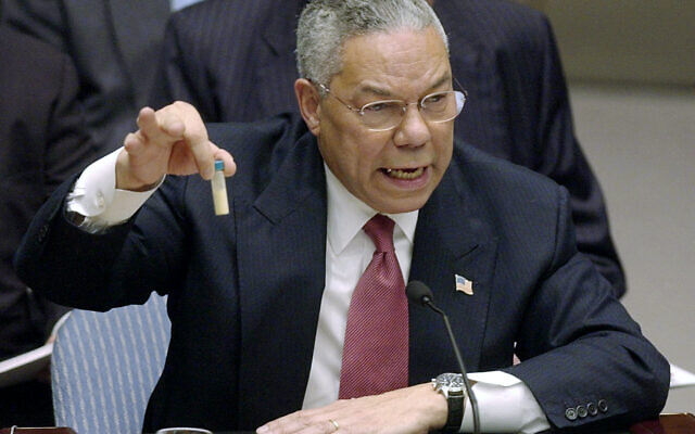 Then-US secretary of state Colin Powell holds up a vial he said could contain anthrax as he presents evidence of Iraq's alleged weapons programs to the United Nations Security Council, on February 5, 2003. (AP Photo/Elise Amendola, File)