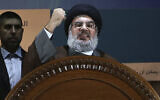Hezbollah leader Sheik Hassan Nasrallah speaks during a rally to mark Al-Quds day, in the southern suburb of Beirut, Lebanon, on August 2, 2013. (AP Photo/Hussein Malla, File)
