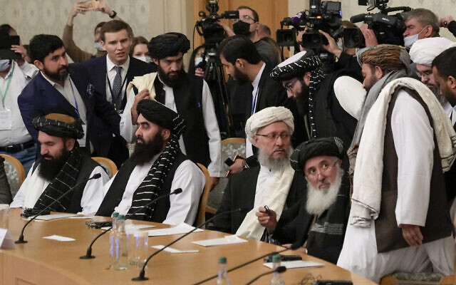 Taliban official Abdul Salam Hanafi, center, and other members of the political delegation from the Afghan Taliban's movement arrive to attend the talks involving Afghan representatives in Moscow, Russia, October 20, 2021. (AP Photo/Alexander Zemlianichenko, Pool)