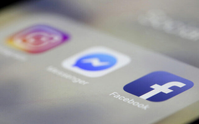 In this file photo from March 13, 2019, Facebook, Messenger and Instagram apps are displayed on an iPhone, in New York. (AP Photo/Jenny Kane, File)
