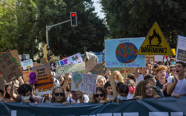 Thousands march through Tel Aviv to call for government action on climate change, October 29, 2021. (AP Photo/Ariel Schalit)