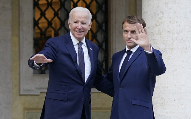 US President Joe Biden, left, and French President Emmanuel Macron wave prior to a meeting at La Villa Bonaparte in Rome on Oct. 29, 2021. (AP Photo/Evan Vucci)