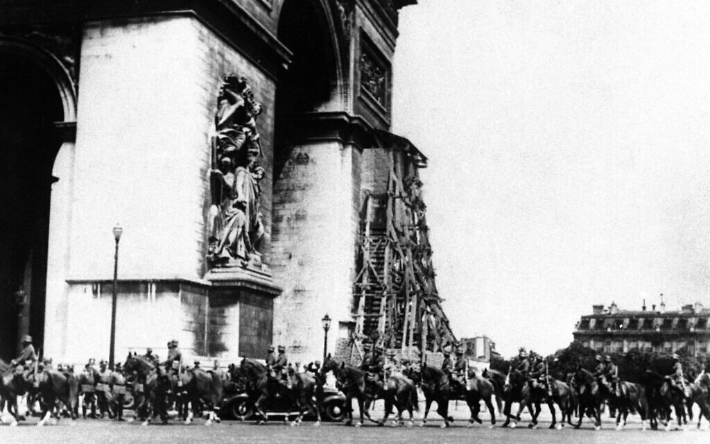 German troops pass the Arc de Triomphe in Paris on June 14, 1940. (AP Photo)