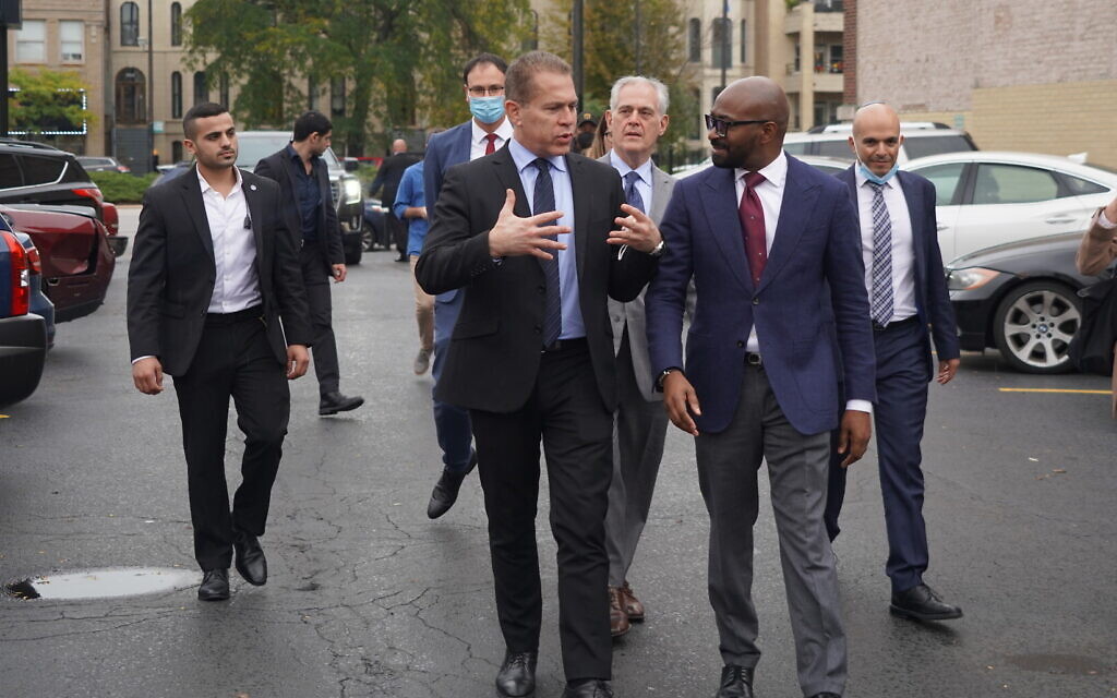 Israeli Ambassador to the US Gilad Erdan walks with Bright Star Church Pastor Chris Harris outside the Bright Star Community Outreach Center in Chicago on October 13, 2021. (Christian Harris)