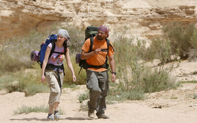 A man and woman walking the Israel Trail. (Miriam Alster/Flash90)