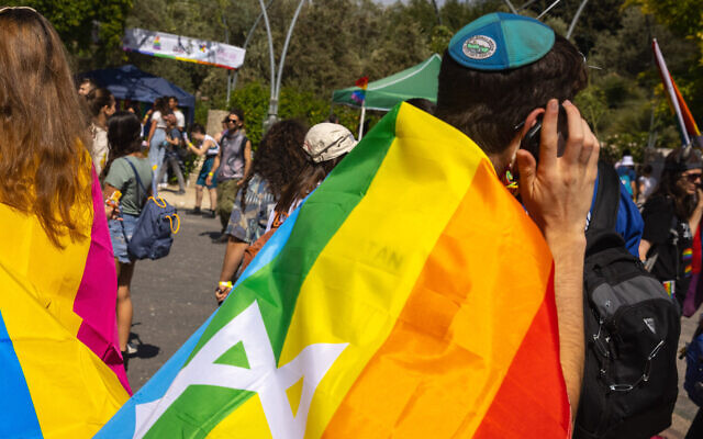 A person speaks on their phone during an annual Gay Pride Parade in Jerusalem, on June 3, 2021. (Olivier Fitoussi/Flash90)