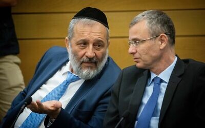 Shas leader Aryeh Deri with Likud's Yariv Levin during a meeting of right-wing parties in the Knesset on June 14, 2021. (Yonatan Sindel/Flash90)