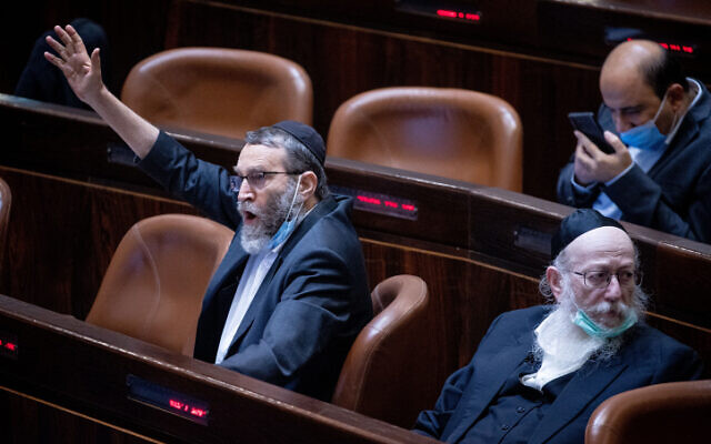 MK Moshe Gafni (left) alongside Yaakov Litzman in the Knesset, on July 26, 2021.(Yonatan Sindel/Flash90)