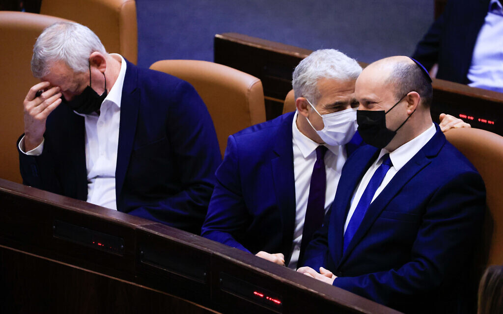 Prime Minister Naftali Bennett (right), Foreign Minister Yair Lapid (center) and Defense Minister Benny Gantz at the Knesset, on September 2, 2021. (Olivier Fitoussi/Flash90)