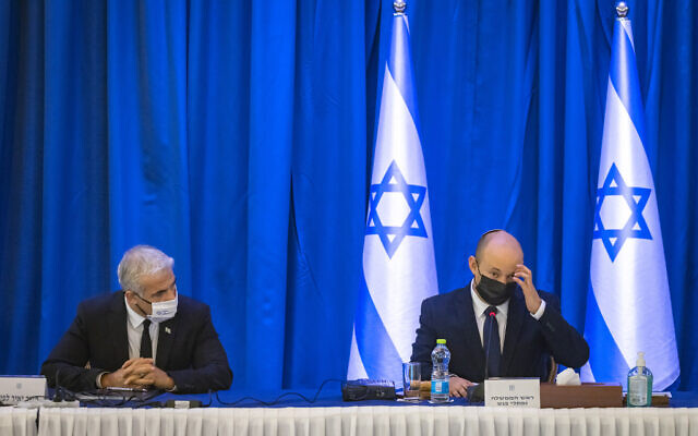 Prime Minister Naftali Bennett (R) and Minister of Foreign Affairs Yair Lapid attend a cabinet meeting in Jerusalem on September12, 2021. (Olivier Fitoussi/Flash90)