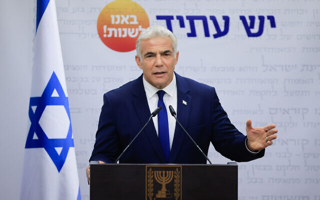 Yesh Atid party leader Yair Lapid speaks during a faction meeting at the Knesset on October 4, 2021. (Olivier Fitoussi/Flash90)