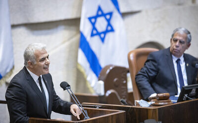 Foreign Minister Yair Lapid speaks during memorial ceremony marking 26 years since the assassination of prime minister Yitzhak Rabin, at the Knesset, on October 18, 2021. (Olivier Fitoussi/Flash90)