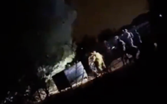 IDF soldiers arrest a Lebanese civilian near Metula after he illegally crossed into Israel on October 29, 2021. (Screen capture/YouTube)
