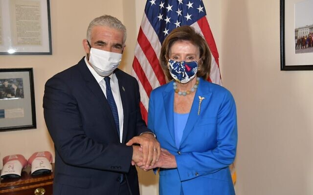 Foreign Minister Yair Lapid (left) meets with House Speaker Nancy Pelosi in Washington on October 12, 2021. (Shlomi Amsalem/GPO)