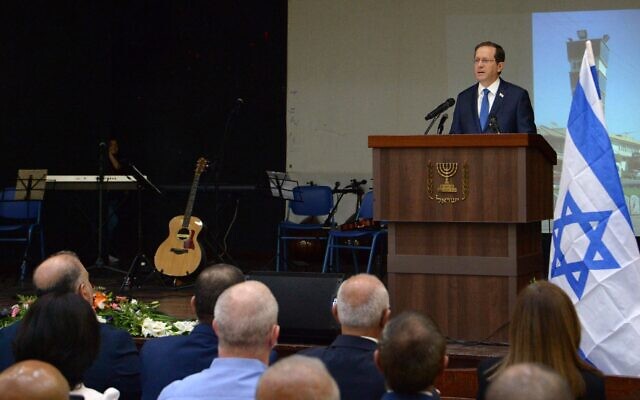 President Isaac Herzog addresses the memorial for the victims of the 1956 massacre in Kafr Qasim, October 29, 2021. (Amos Ben Gershom/GPO)