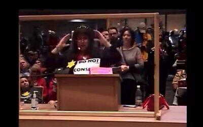 Anti-mask activist wearing a yellow star at the Anchorage Assembly meeting on mask mandates, September 20, 2021 (Screen grab/Twitter)