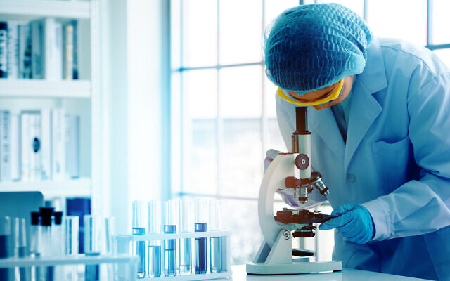 An illustrative photo of a scientist in working in a lab. (Rapeepat Pornsipak via iStock by Getty Images)