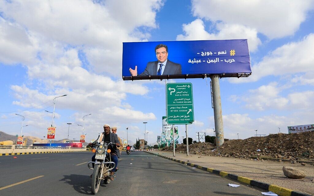 A portrait of Lebanese Information Minister George Kordahi is displayed on a billboard in the Yemeni capital Sanaa on October 31, 2021. (Mohammed HUWAIS / AFP)