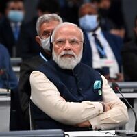 Indian Prime Minister Narendra Modi listens to a speaker during the opening ceremony of the COP26 UN Climate Change Conference in Glasgow, Scotland on November 1, 2021. (Jeff J. Mitchell/Pool/AFP)