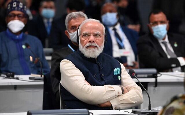 Indian Prime Minister Narendra Modi listens to a speaker during the opening ceremony of the COP26 UN Climate Change Conference in Glasgow, Scotland on November 1, 2021. (Jeff J. Mitchell/Pool/AFP)